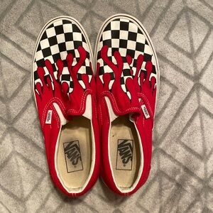 Checked Slip on Vans with red flames.